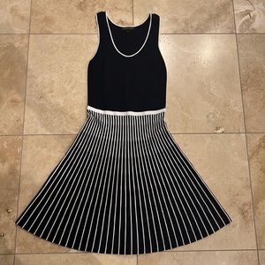 Blue knit dress with flared striped skirt